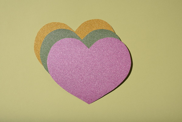 Some Multicolored Heart-Shaped Valentine Cards on Light Background